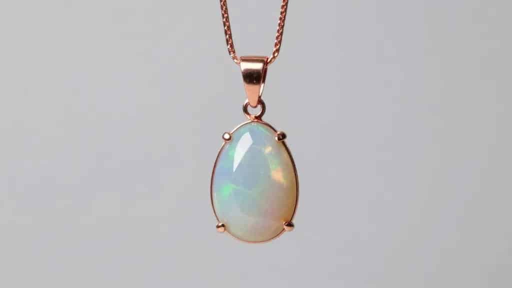 single rainbow opal pendant on fine rose gold chain
