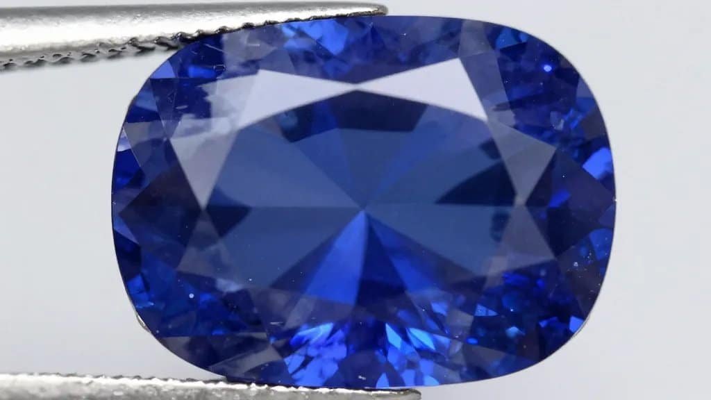 closeup of cushion-cut sapphire showing vivid royal blue saturation