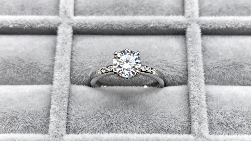 closeup of diamond ring in individual velvet-lined slot