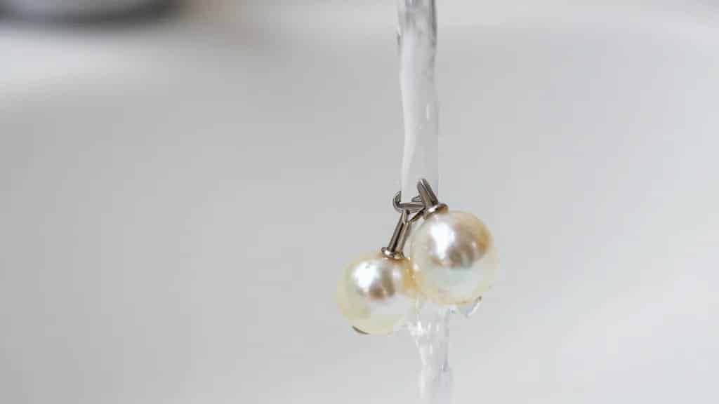 pearl strand clasp under running lukewarm water, closeup