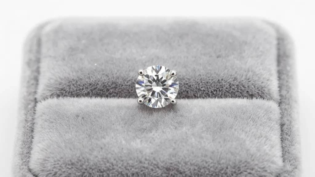 single lab-grown diamond stud earring on velvet pad