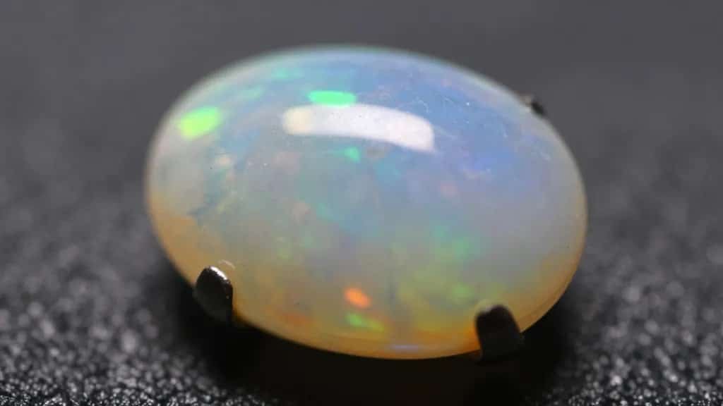 Macro of opal play-of-color in polished cabochon