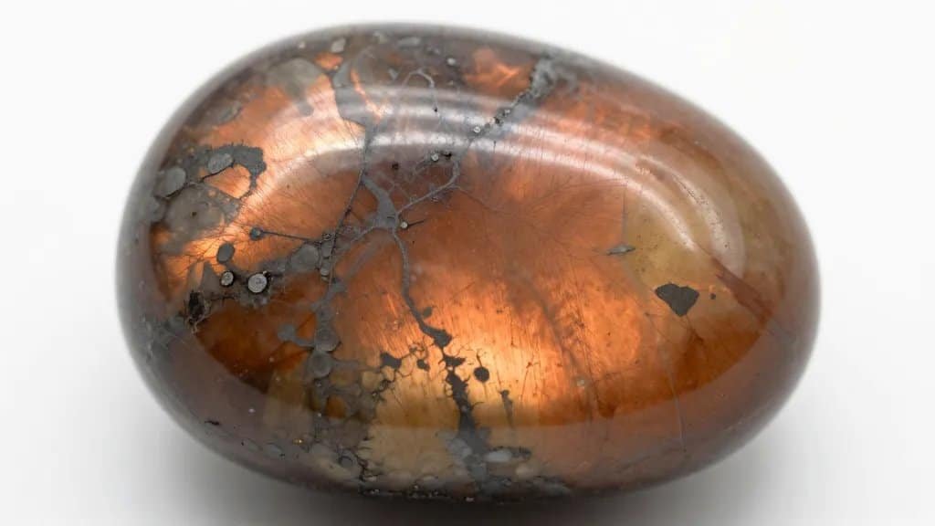closeup Oregon sunstone crystal showing copper schiller inclusions