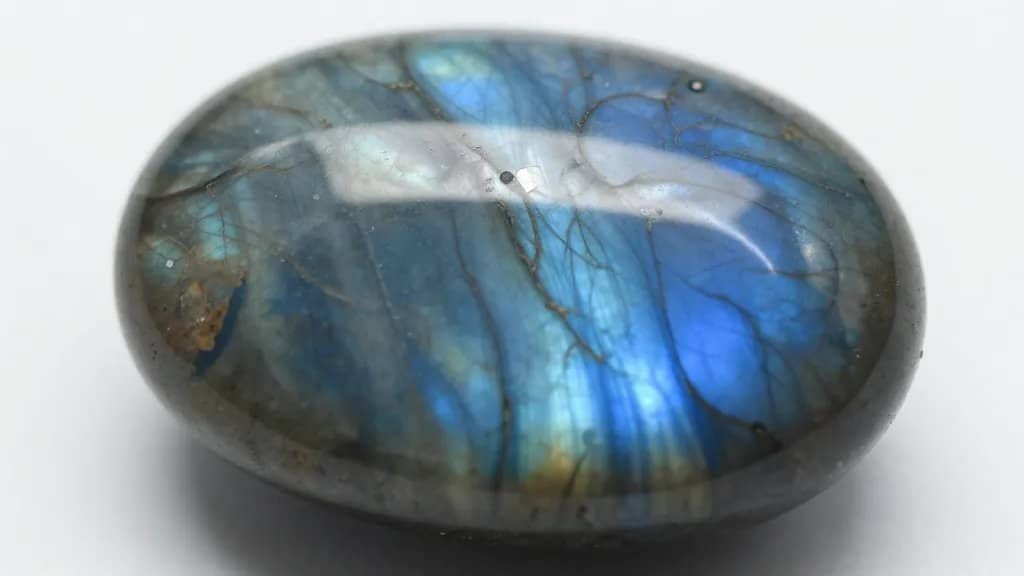 macro shot of polished labradorite cabochon with blue labradorescence